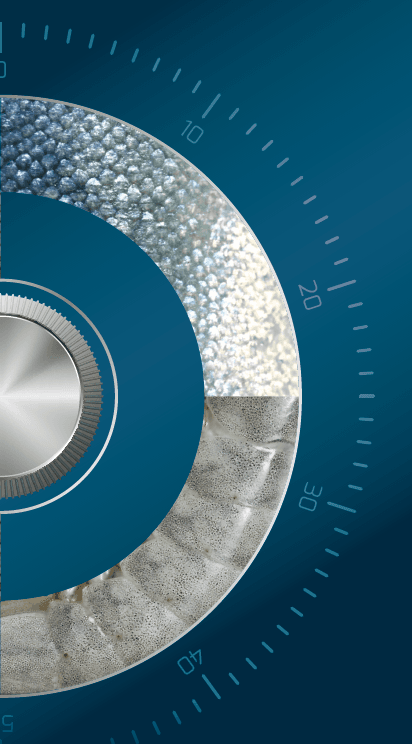 Blue circular dial with a silver center, segmented ring, diverse textures, and numerical markings.